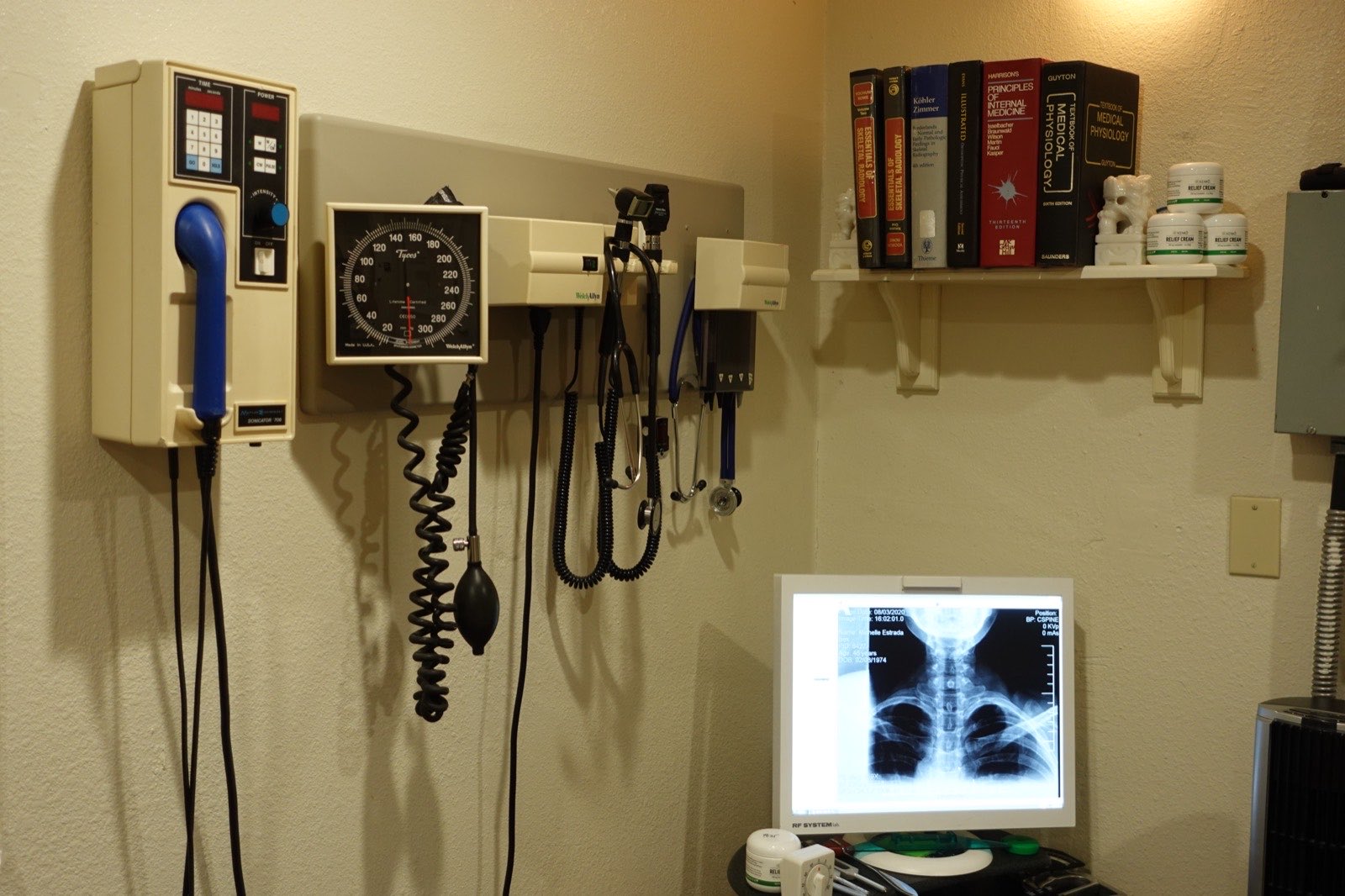 Examination room with diagnostic equipment and an X-ray viewer