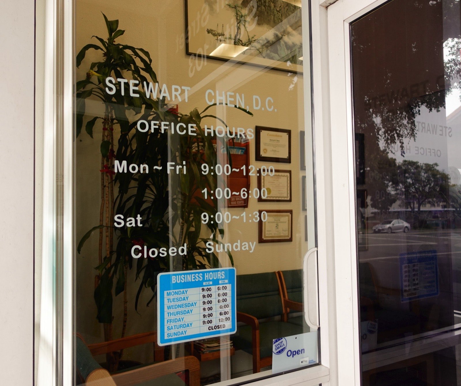 Clinic hours displayed on the glass door