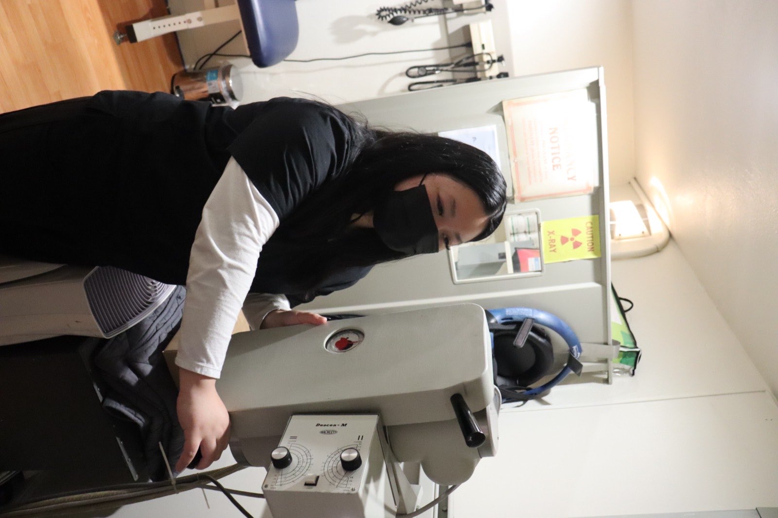 Clinic staff operating the on-site digital X-ray unit